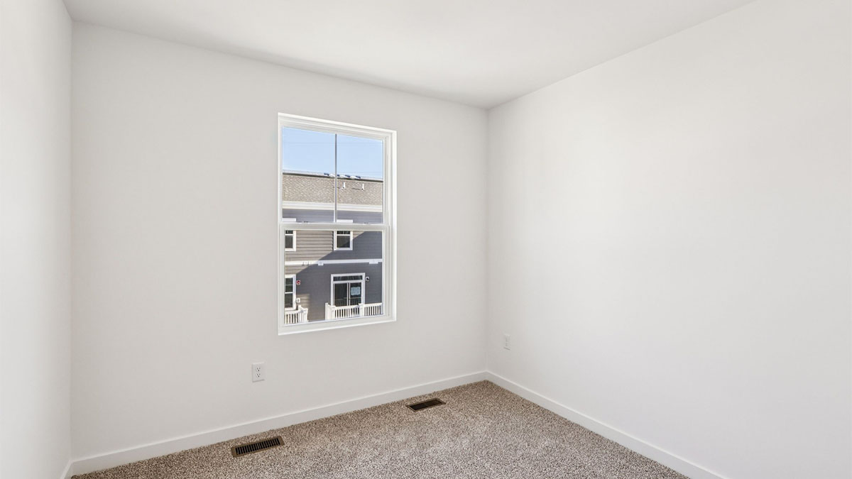 bedroom with carpet and window