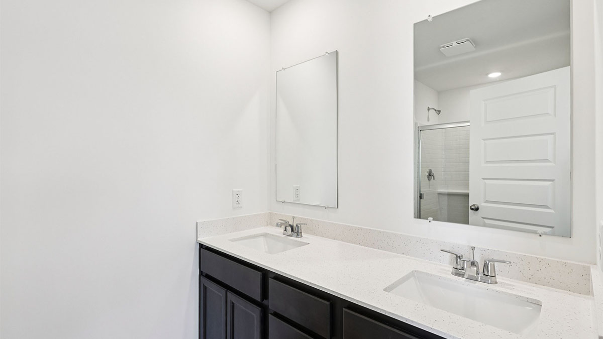 primary bathroom with dual sink vanity