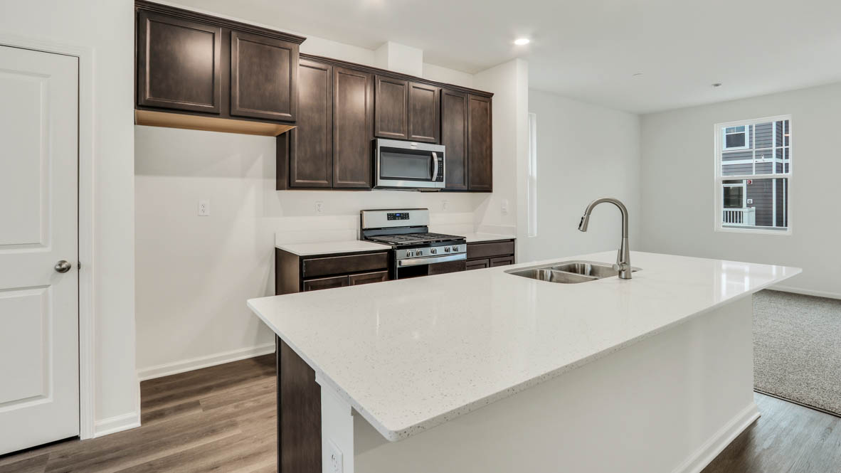 Kichen with large island with sink and dishwasher