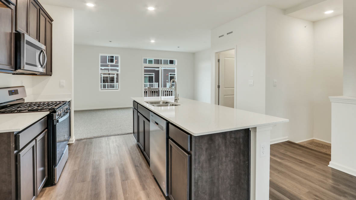 Kitchen in between great room and dining room