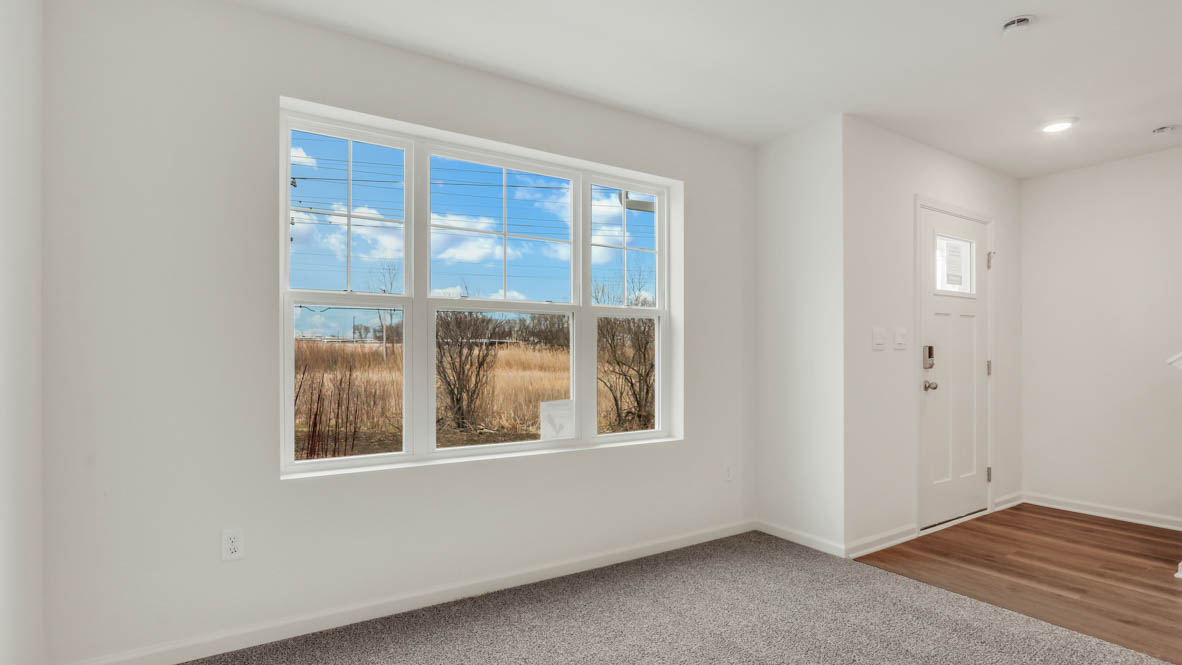 A foyer, entry hall inside front door, next to office, or sitting room adding a welcoming front, direct line of sight to home