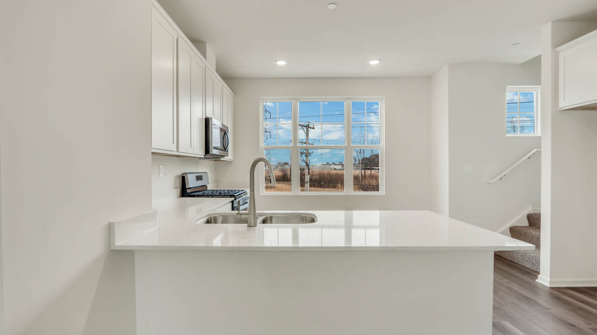 Central kitchen adds a sink, seating, designed to anchor the home, pantry, prep zones, perfect for entertaining, everyday life