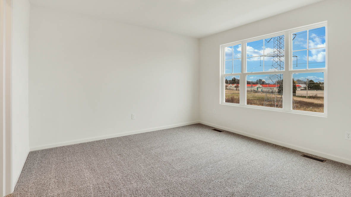 Owner’s suite offers natural window light, spa-inspired ensuite bathroom, backyard view, walk-in closet for everyday style