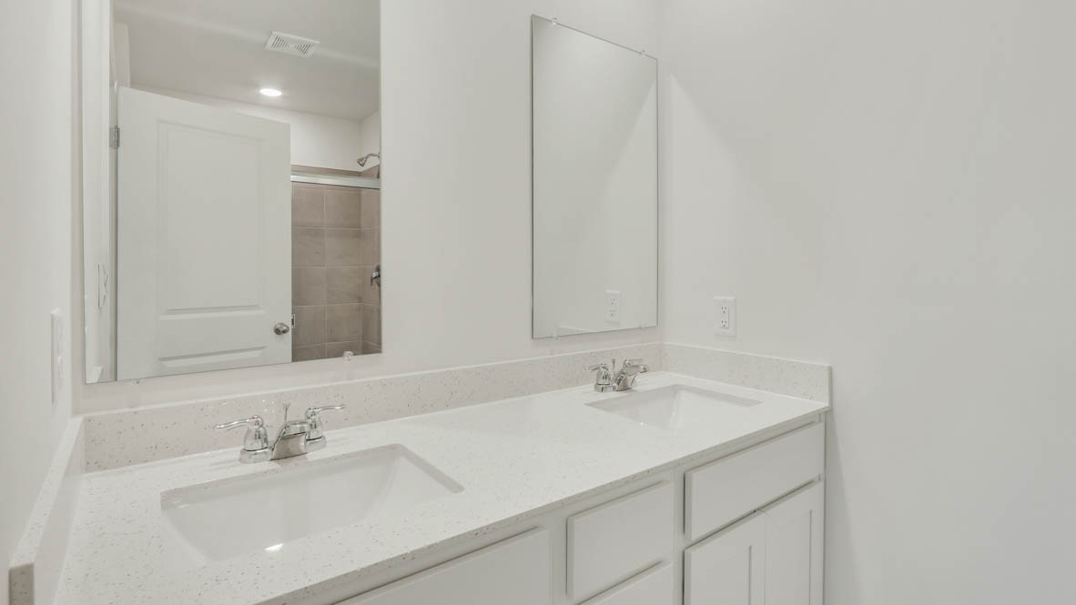 Owner’s ensuite in a new build home offers function and style with a walk-in closet, spa-like ensuite