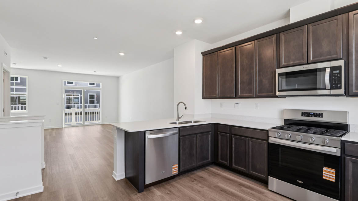 open-concept kitchen with quartz countertops