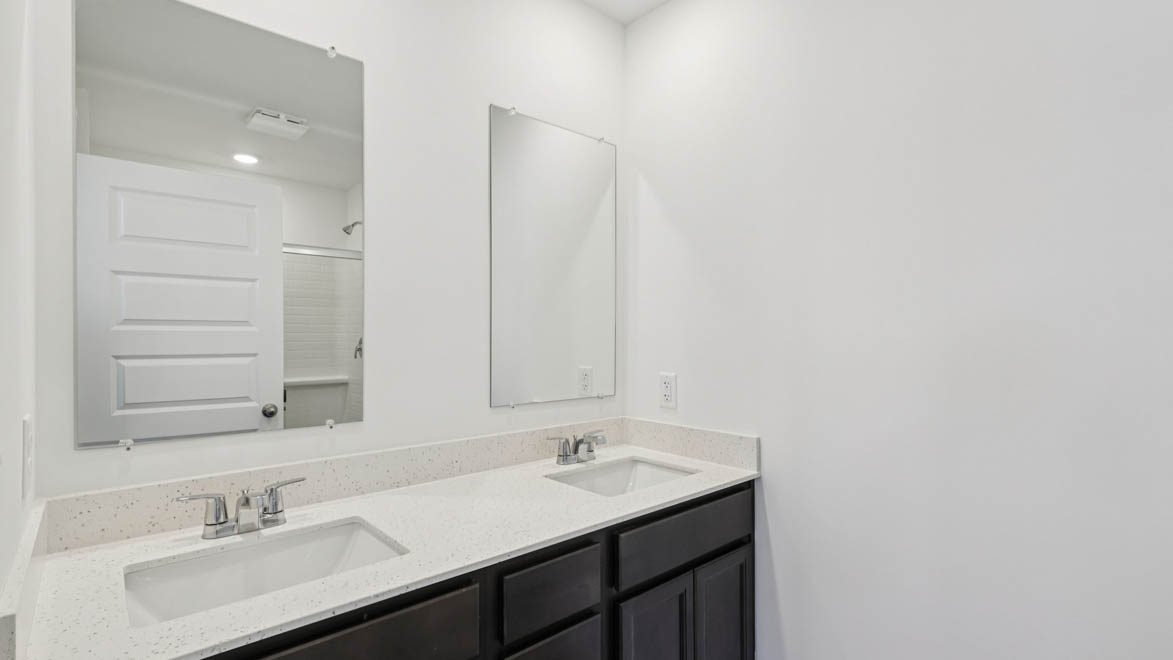bathroom with dual sink vanity