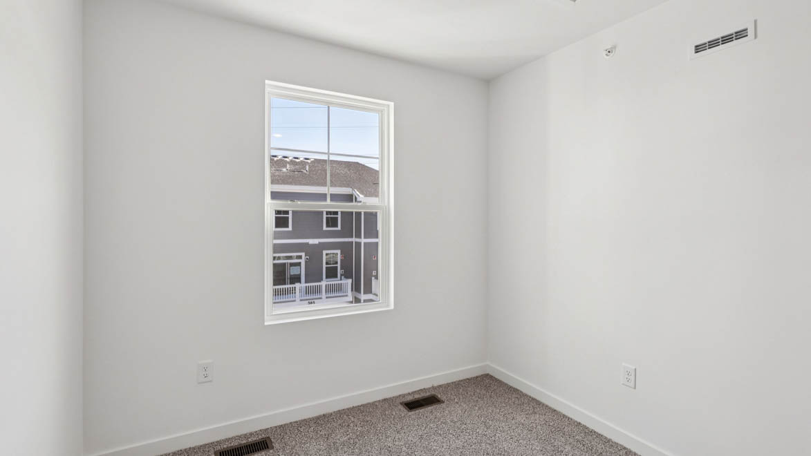 bedroom with carpet and window