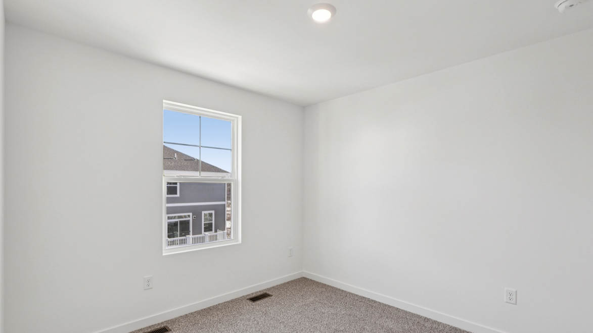 bedroom with carpet and window