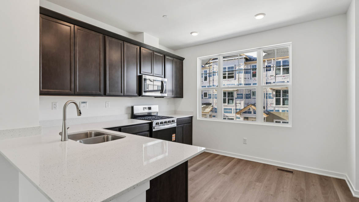 open-concept kitchen with quartz countertops