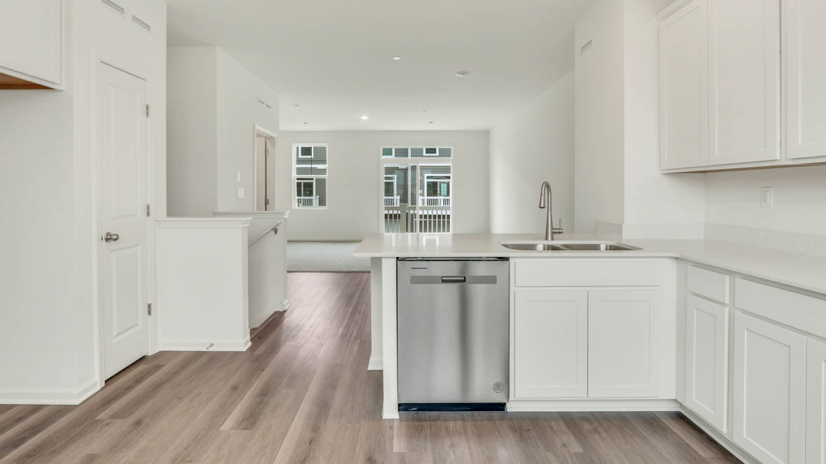 Kitchen overlooking dining room and great room