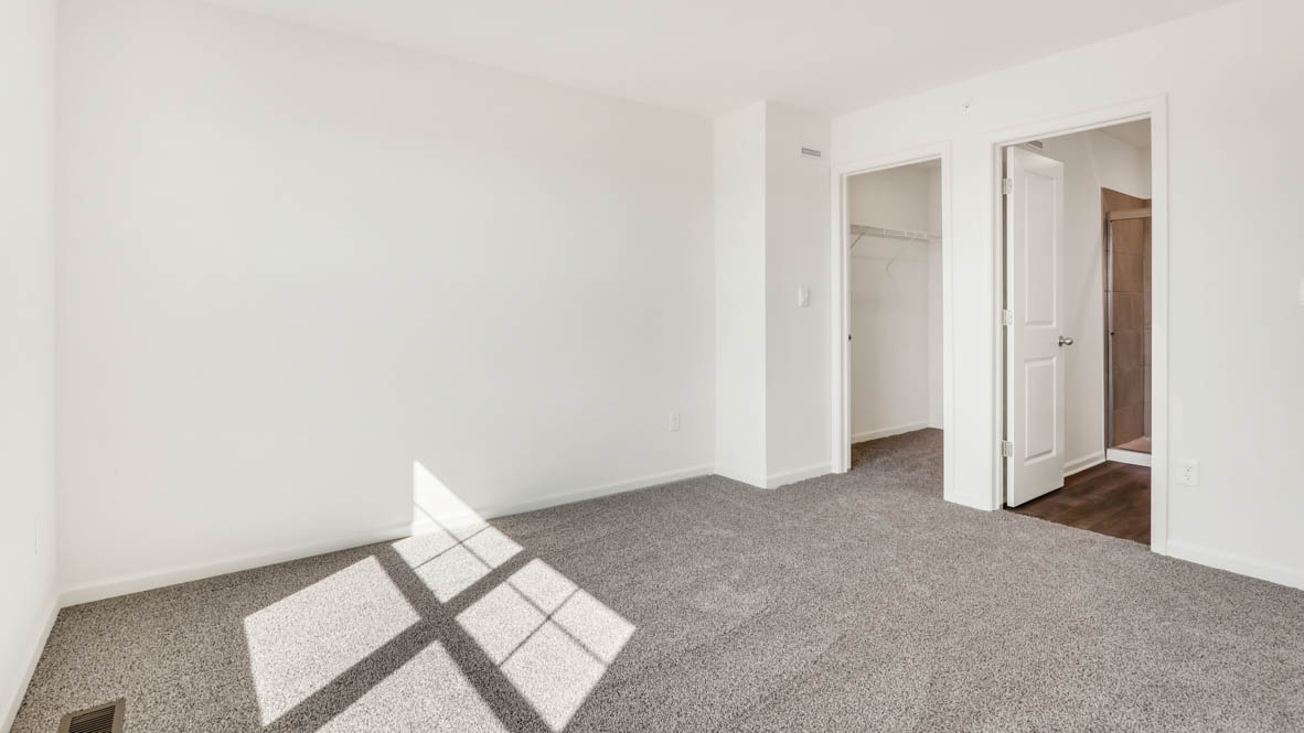 Primary bedroom with connecting en suite