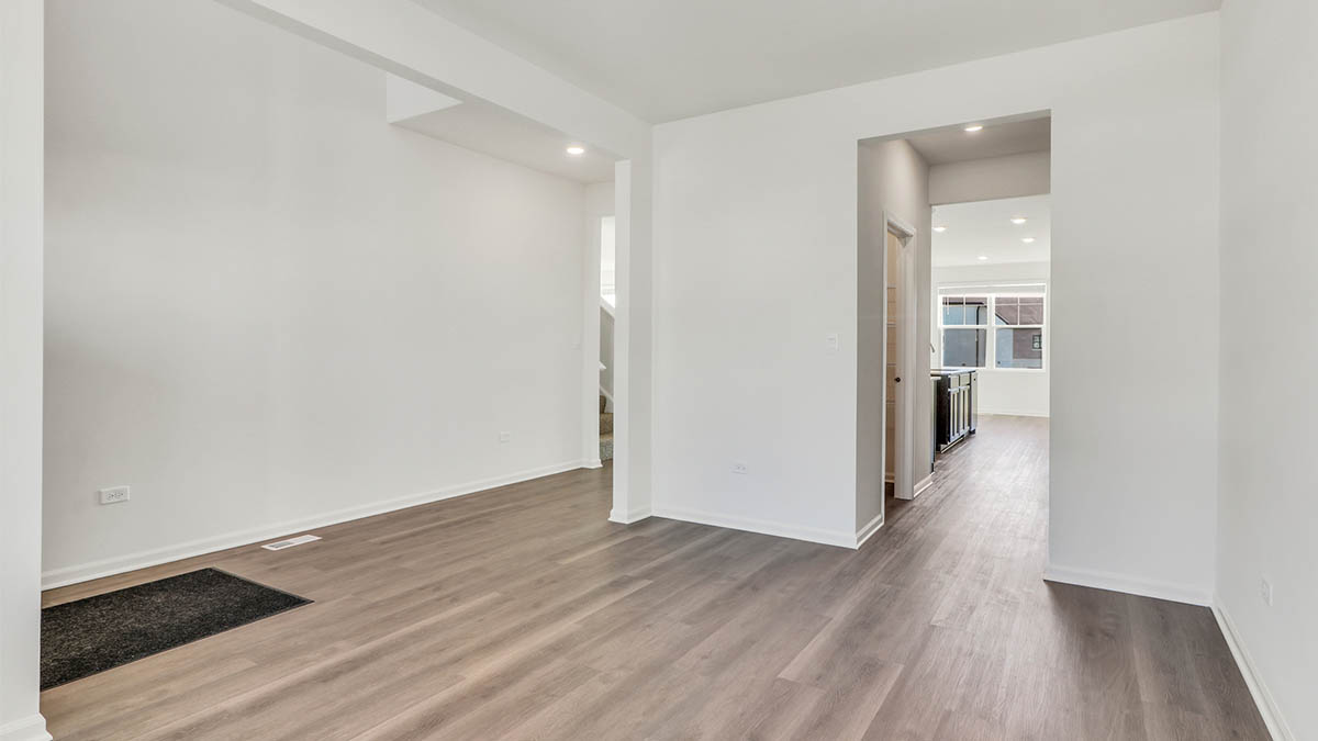 Flex room with hallway leading to kitchen
