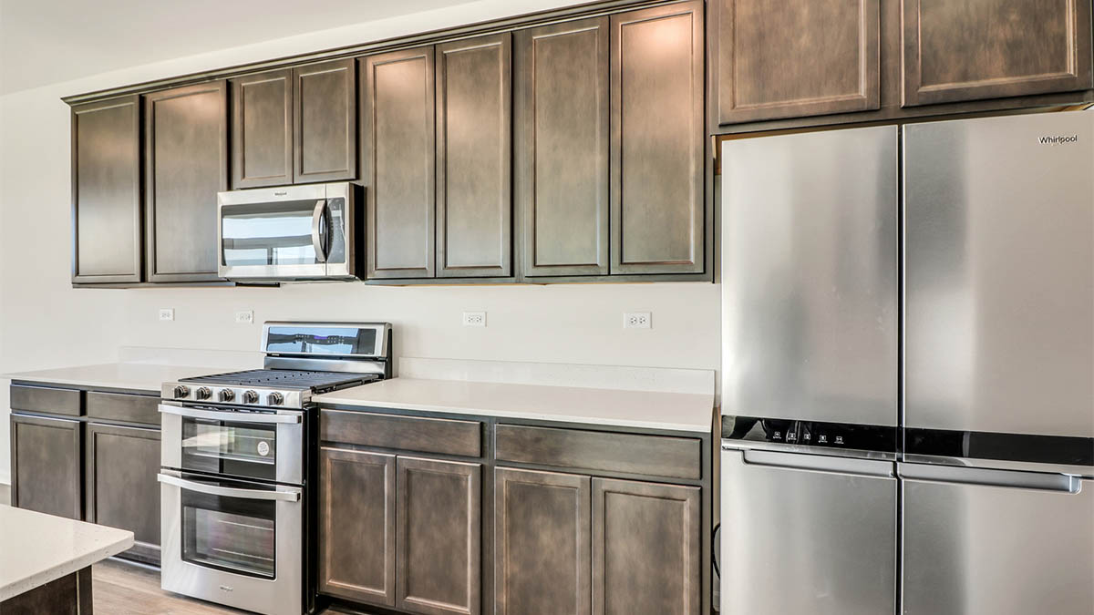 Kitchen with flagstone cabinets an white quartz countertops