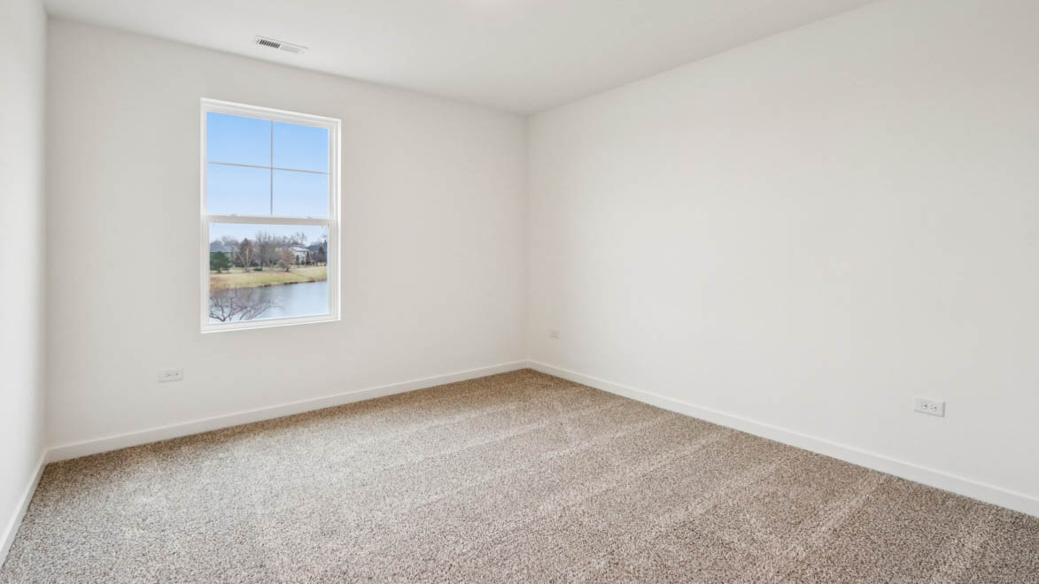 bedroom with carpet and window