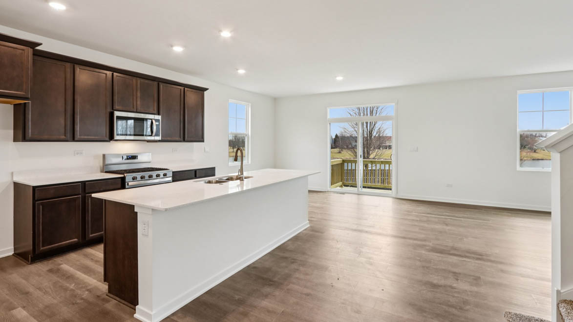 large kitchen with upper and lower cabinets