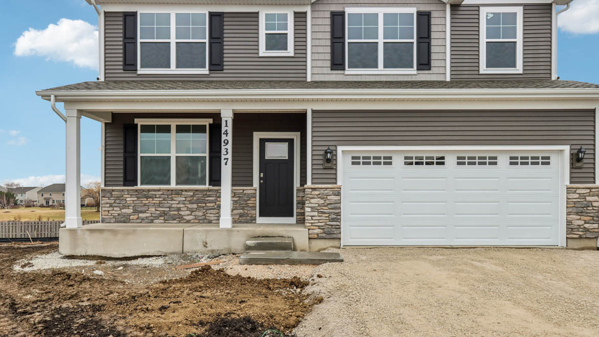 Coventry home with stone and vinyl siding