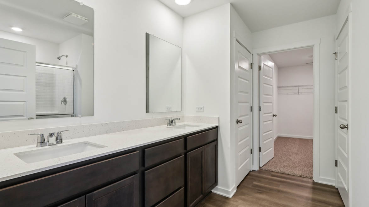 primary bathroom with dual sinks
