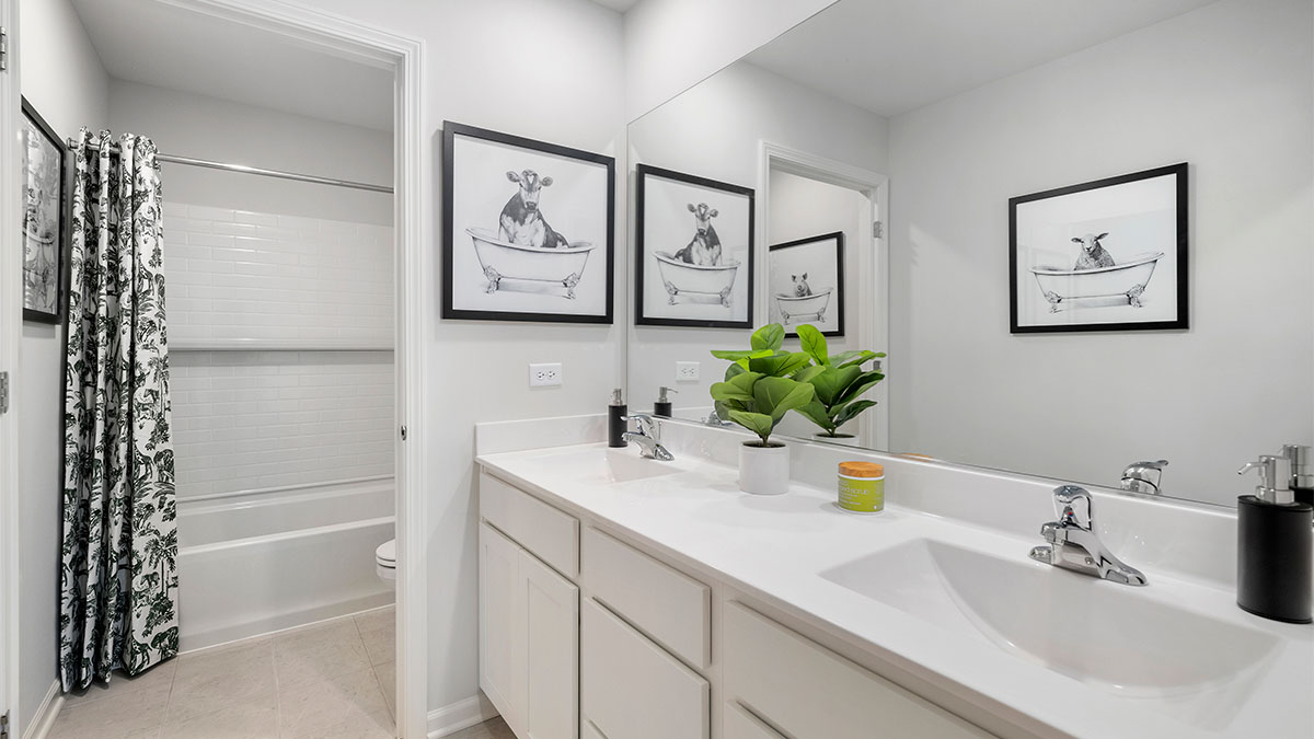 Secondary full bathroom with dual sinks