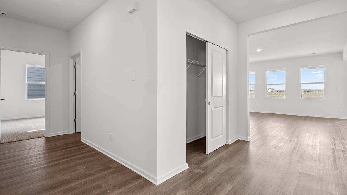 Hallway leading to laundry room and bedroom number 3