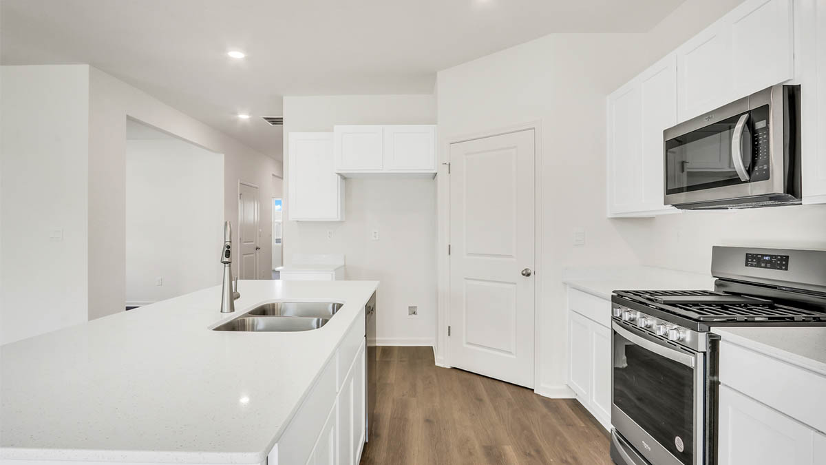 Kitchen with large island and white cabinets