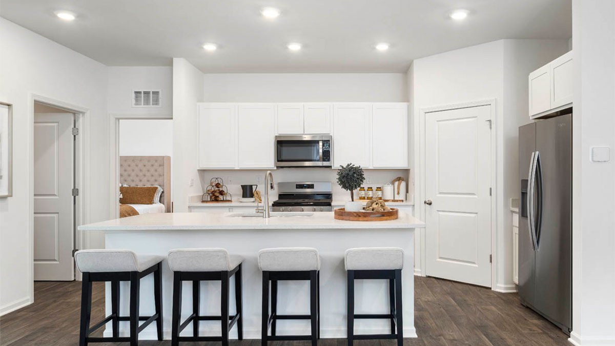 Kitchen with white cabinets and stainless steel appliances