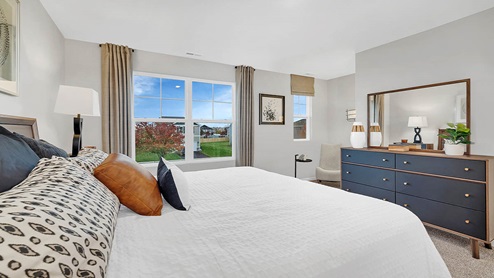 primary suite with large windows