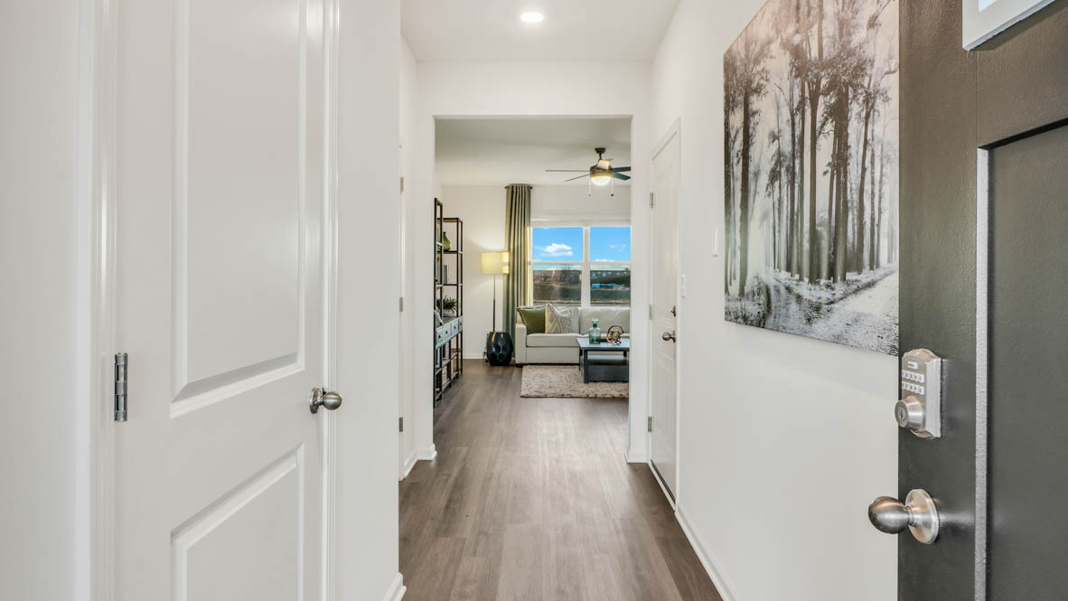 hallway that leads to open concept living space