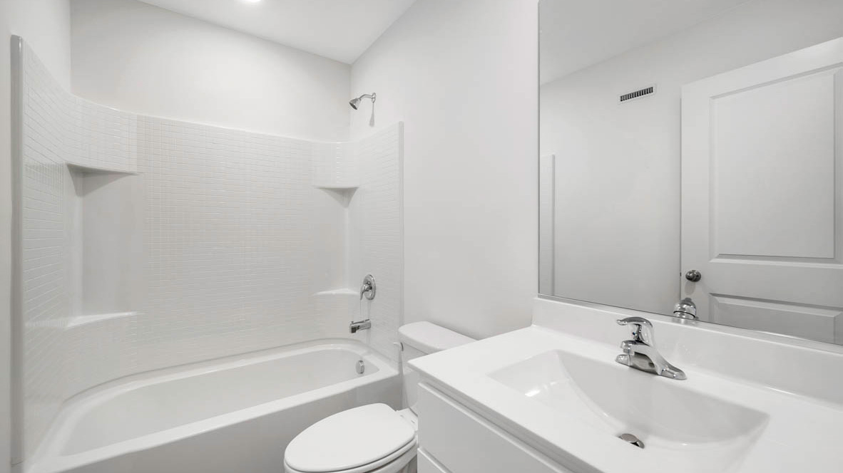 Bathroom with shower and sink and light cabinet and tub