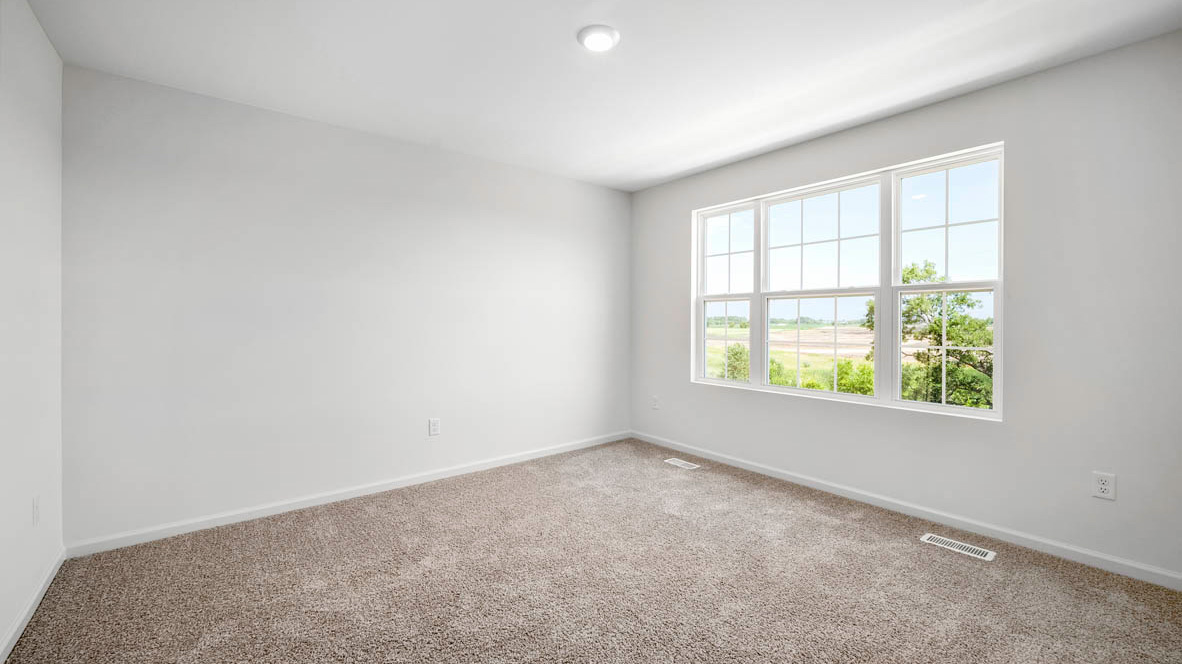 Bedroom with light décor and ceiling fan and big window