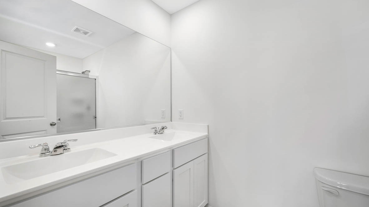 Bathroom with shower and sink and light cabinet