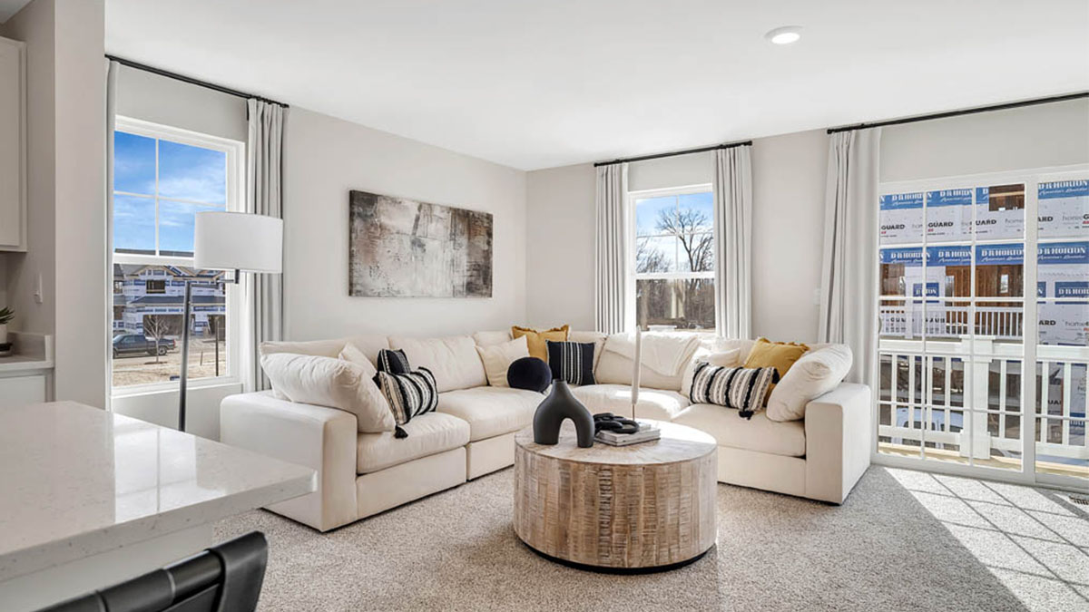 Open living room with windows for natural lighting.