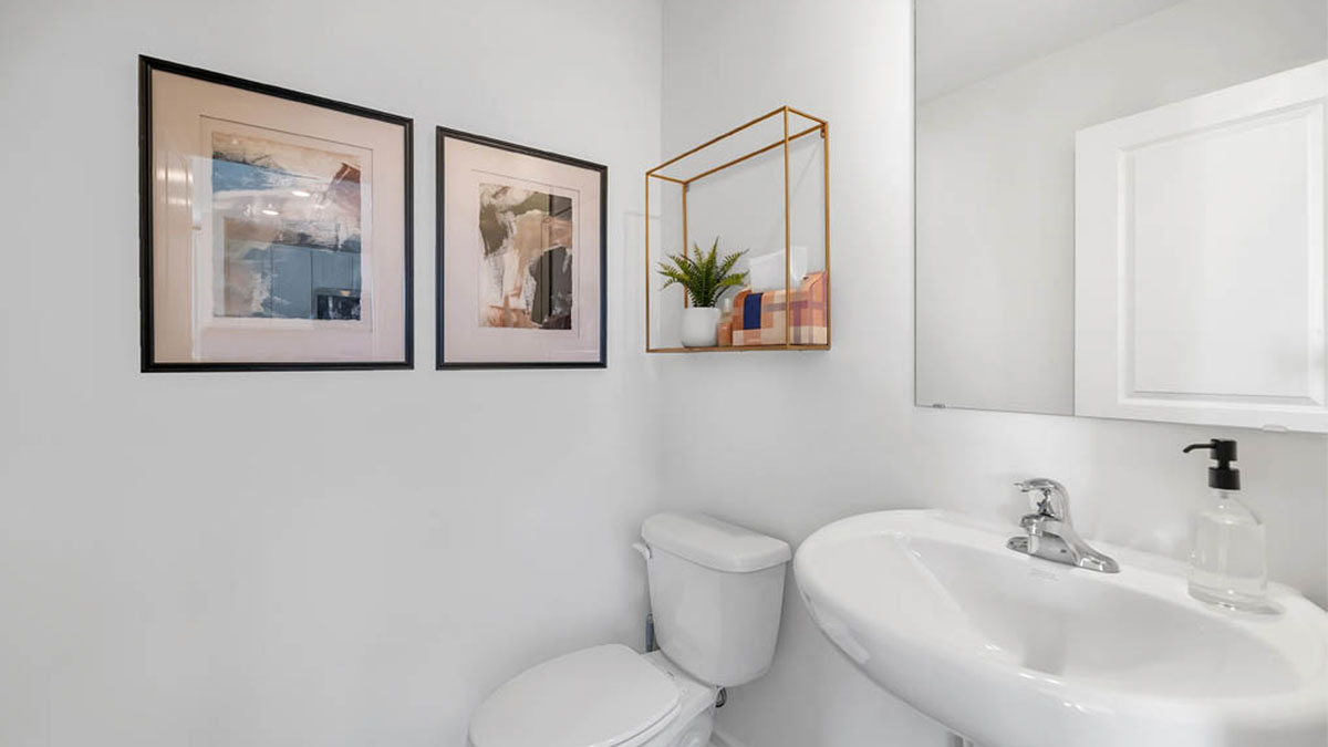 Bathroom with sink and toilet and light cabinet