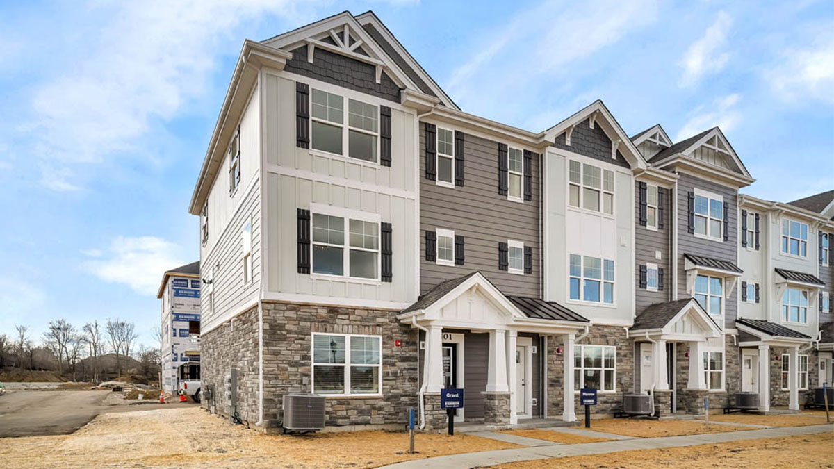 Exterior with brown and white siding