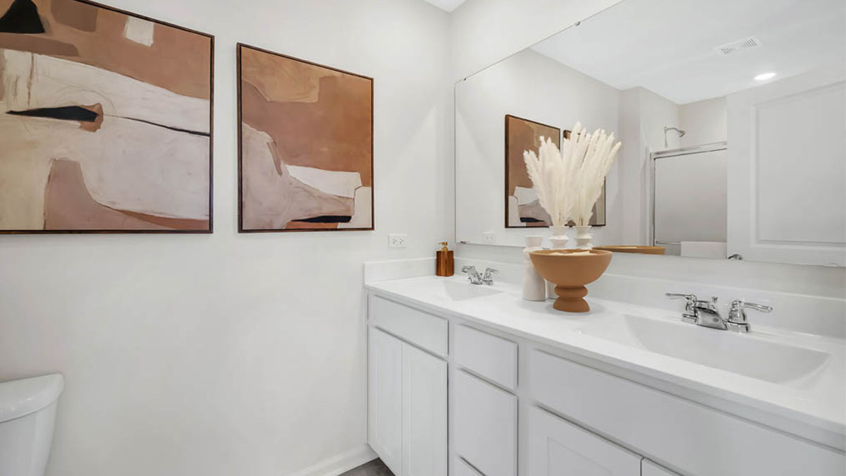 Bathroom with sink and toilet and light cabinet