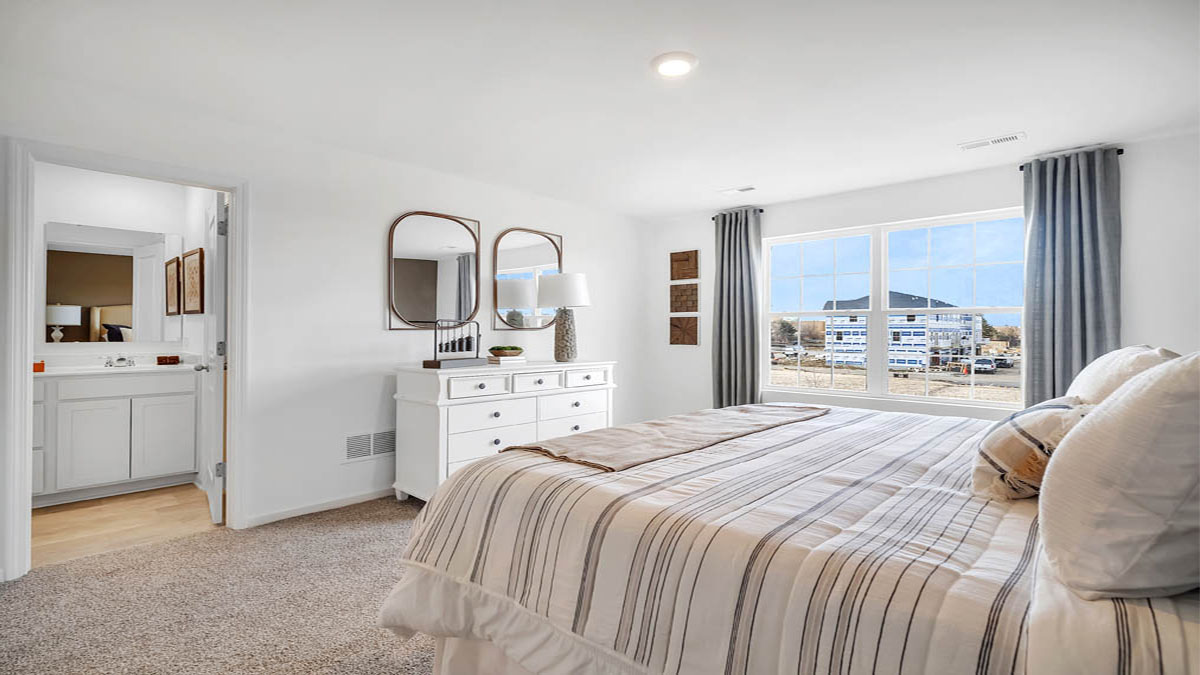 Primary bedroom with connecting en suite