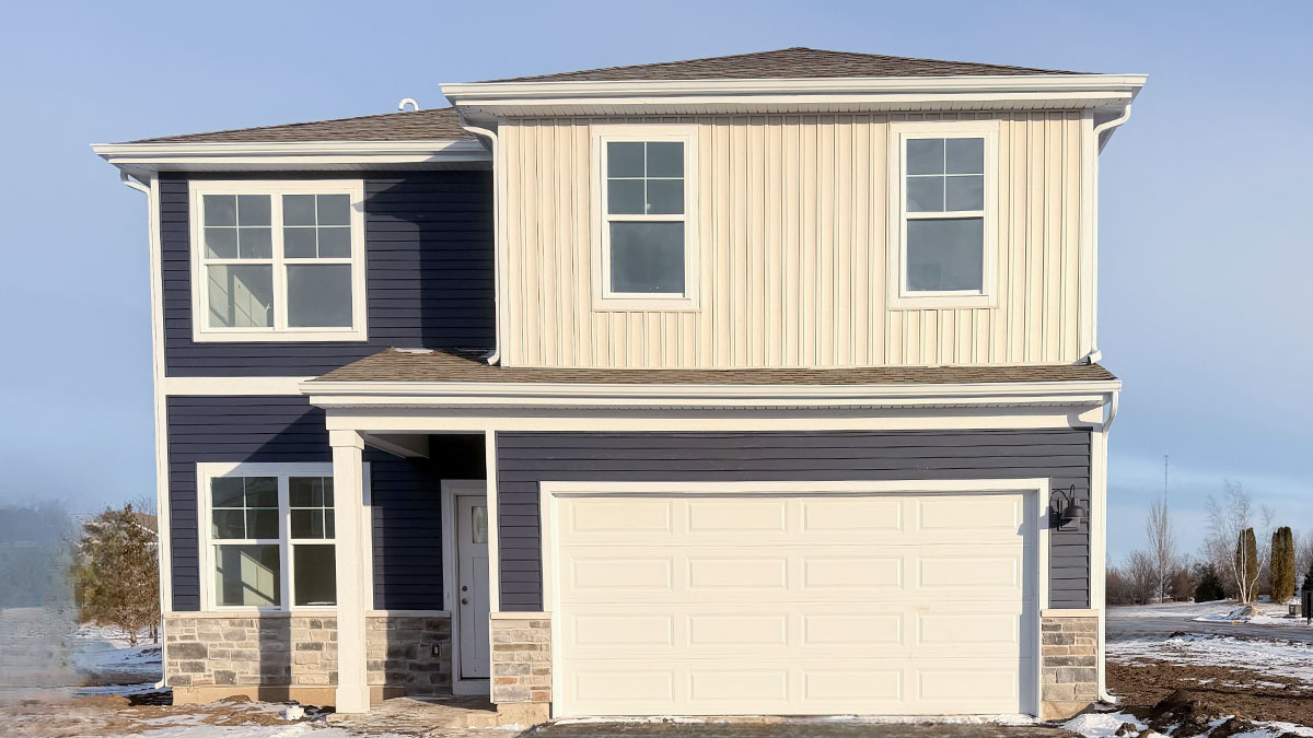2-story single family home with stone wainscot