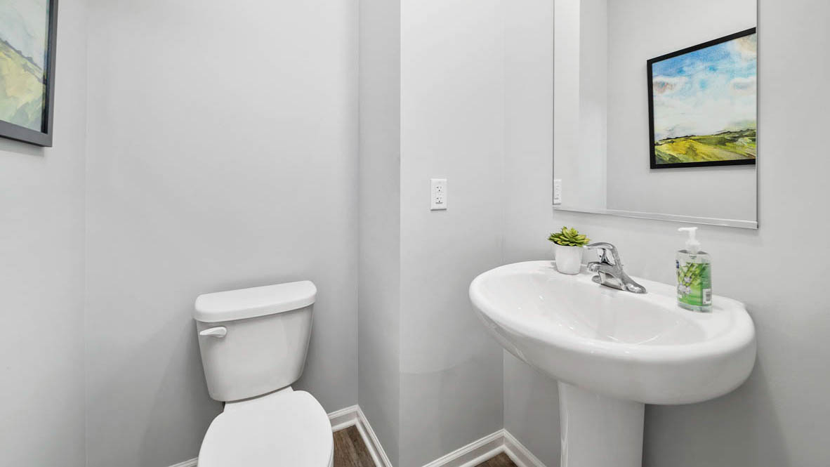 half bathroom with a single sink and toilet.