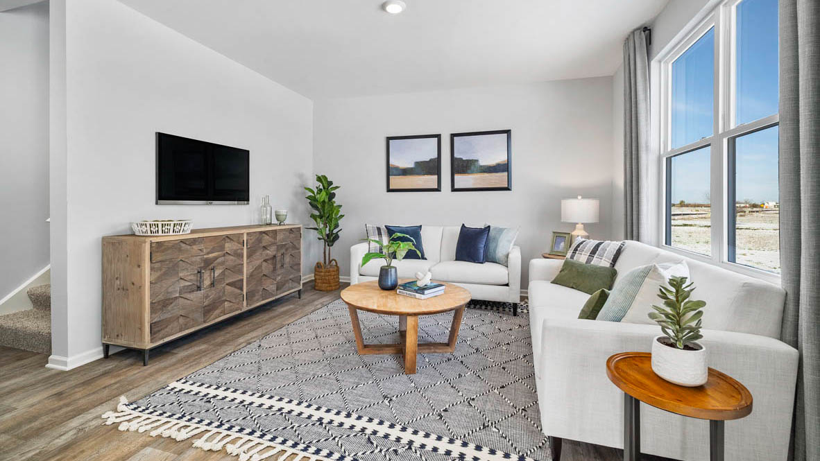 Living room with luxury vinyl plank flooring.