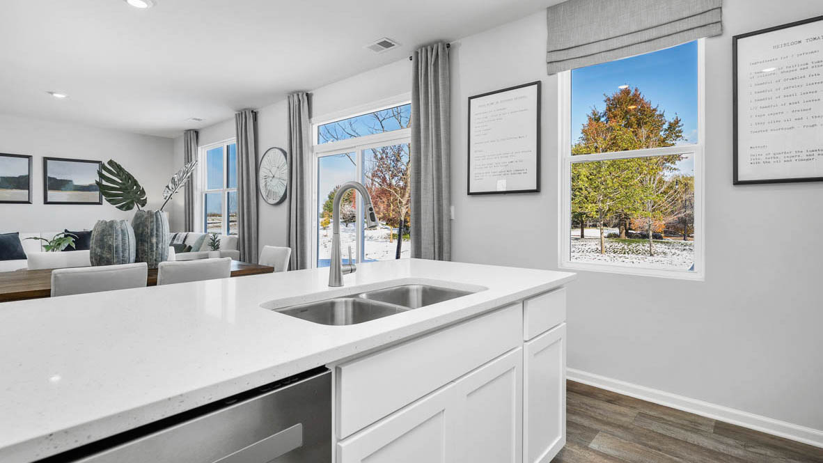 Kitchen with open view of living room.