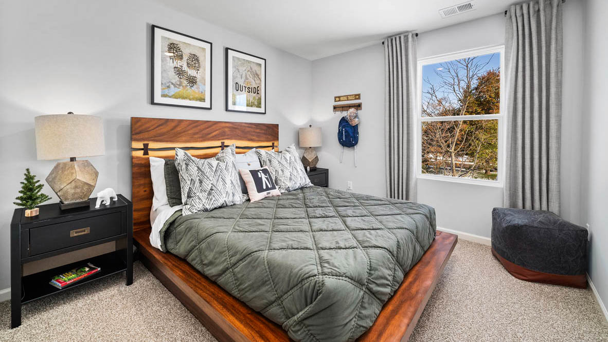 Bedroom with a single window and carpeted floors.
