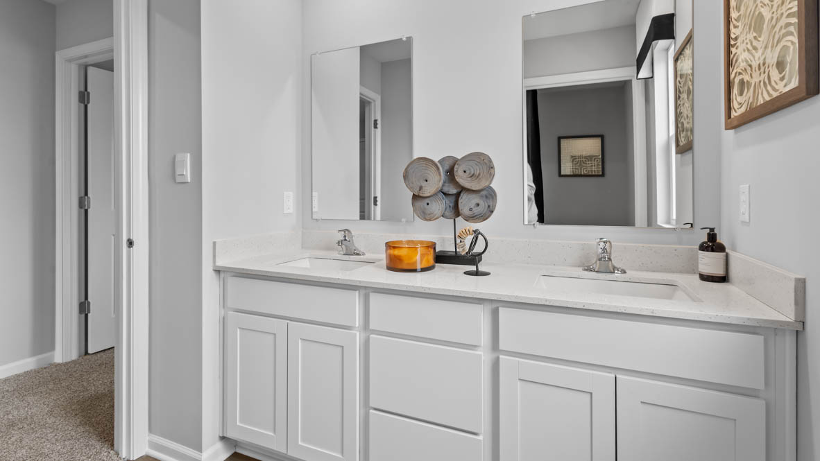 Secondary bathroom with dual vanity sinks
