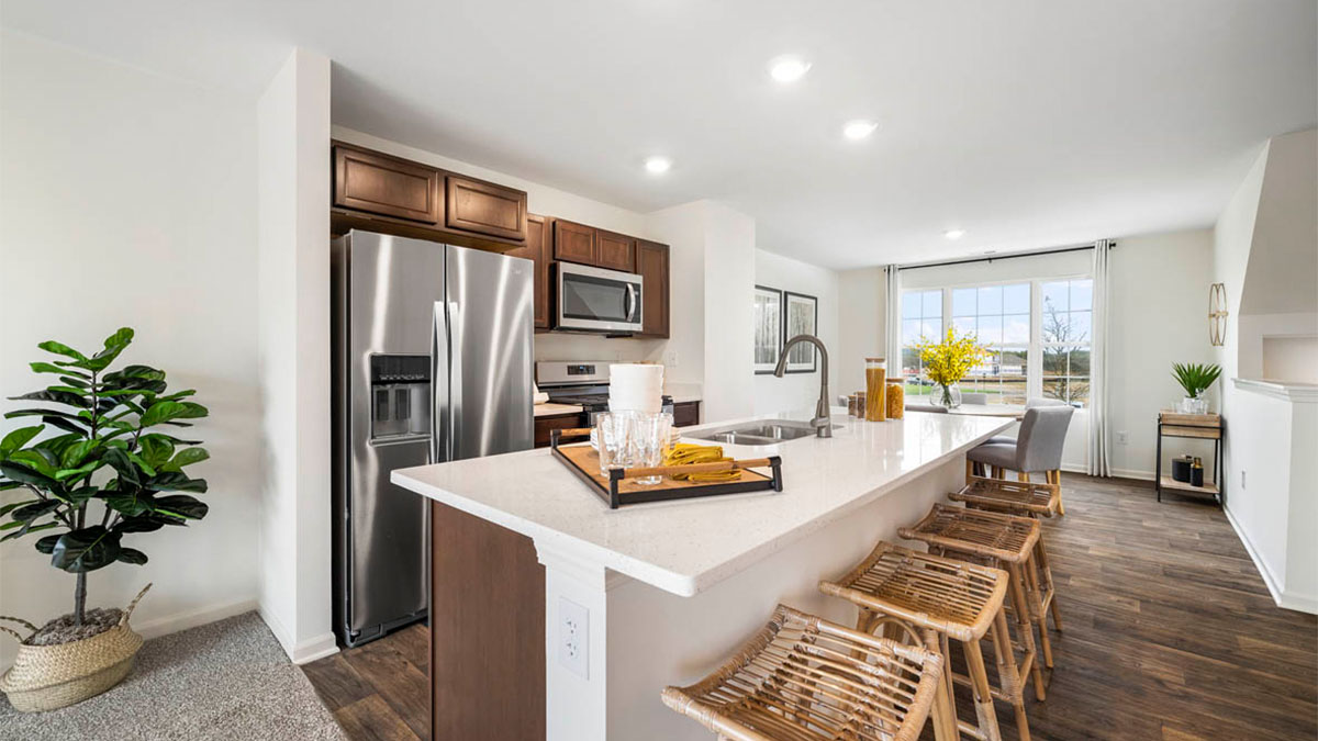 kitchen interior with dark cabinets and large island