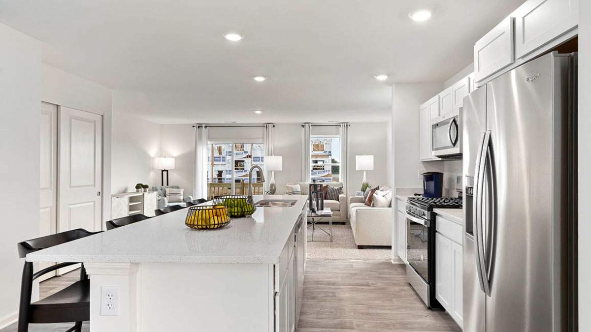 kitchen interior with white cabinets and stainless steel appliances