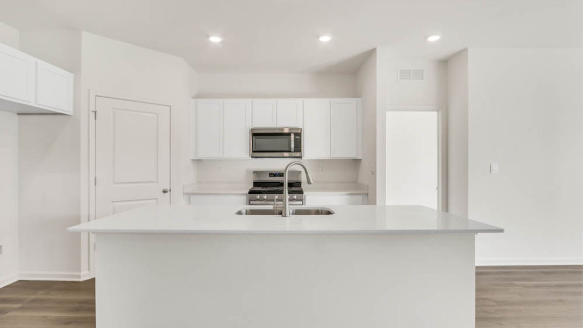 large kitchen island with white cabinets