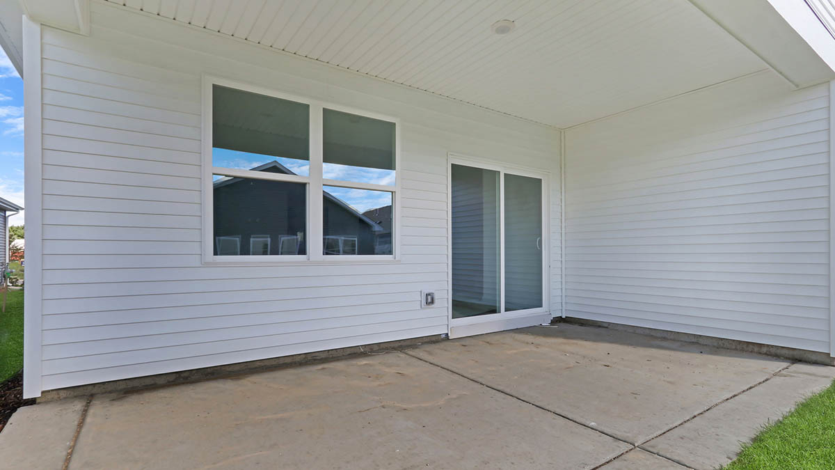 back patio with access to backyard