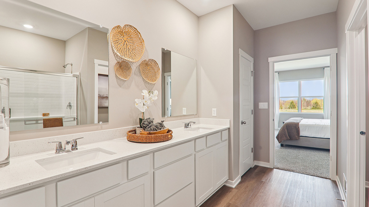 primary bathroom with white cabinets