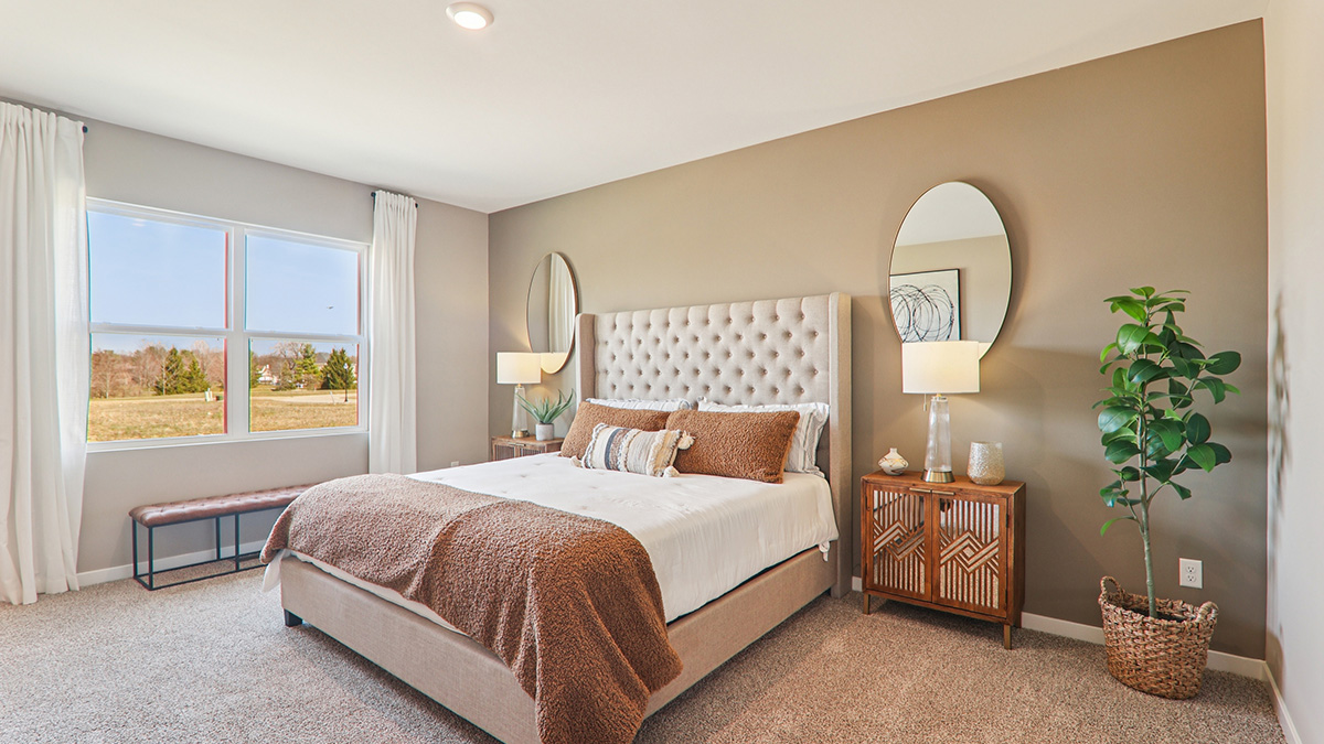 Primary bedroom with large window