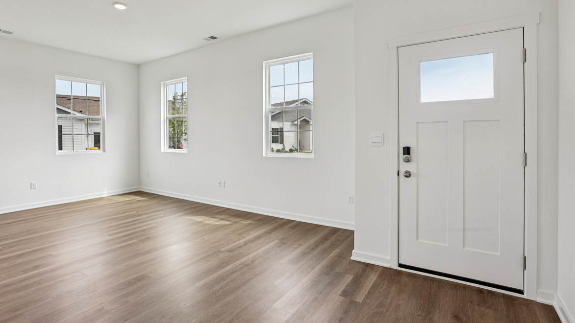 A foyer, entry hall inside front door, next to office, or sitting room adding a welcoming front, direct line of sight to home