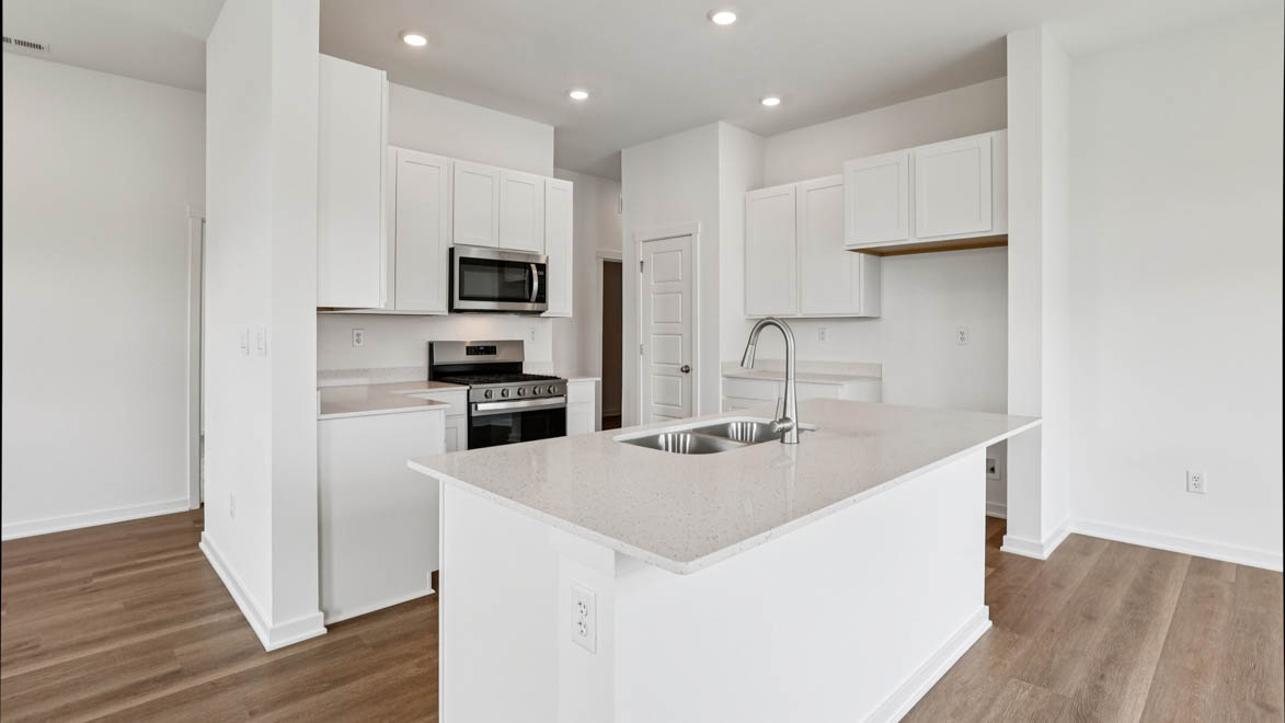 Central kitchen island with sink, seating, crafted to anchor the home, pantry, prep zones, perfect for entertaining and everyday gathering