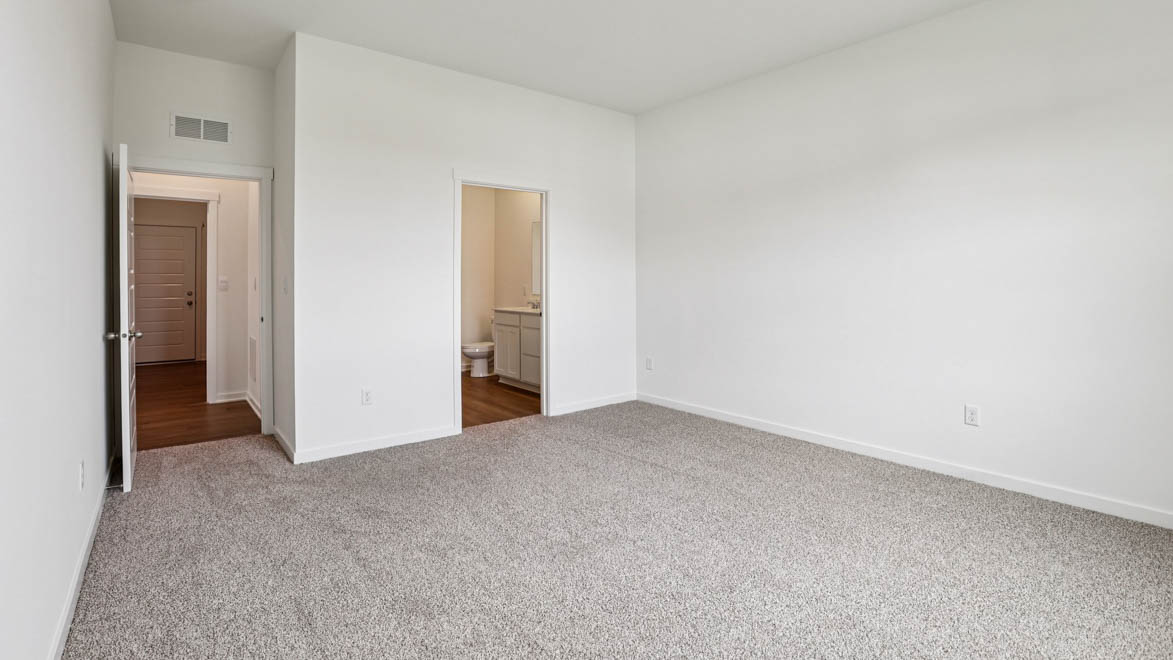 Owner’s suite offers natural window light, spa-inspired ensuite bathroom, backyard view, walk-in closet for everyday style